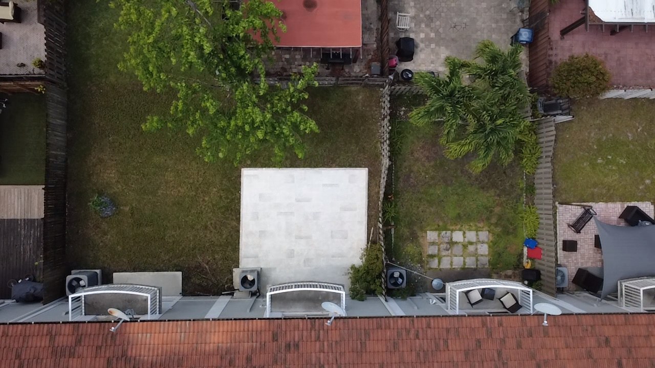 Aerial view of a townhome patio, freshly cleaned